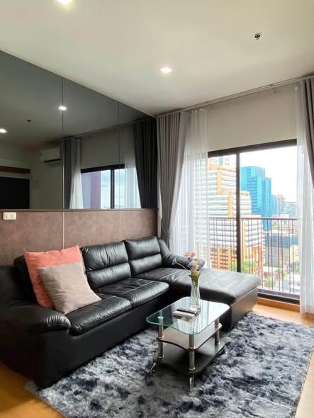 living room and bedroom of Noble Reveal