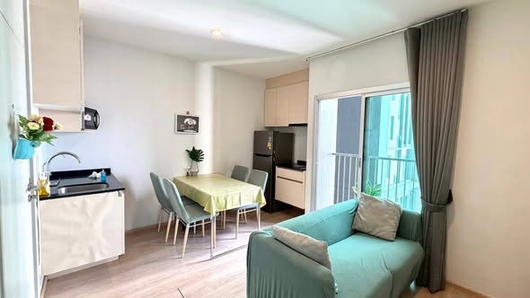 living room and bedroom of Noble Revolve Ratchada 1