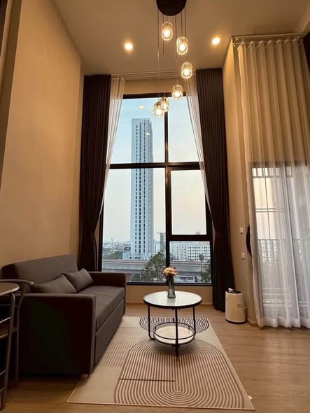 living room of Origin Plug & Play Nonthaburi Station