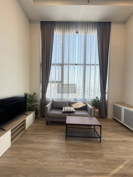 living room and room interior of Ramada Plaza by Wyndham Bangkok Sukhumvit 48