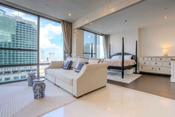 bedroom and living room of The Bangkok Sathorn