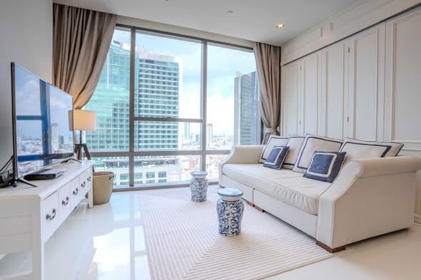 bedroom and living room of The Bangkok Sathorn