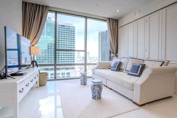 bedroom and living room of The Bangkok Sathorn