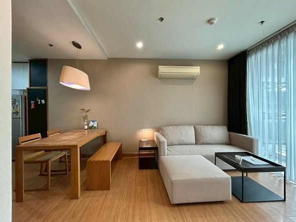 bedroom and living room of The Complete Narathiwas