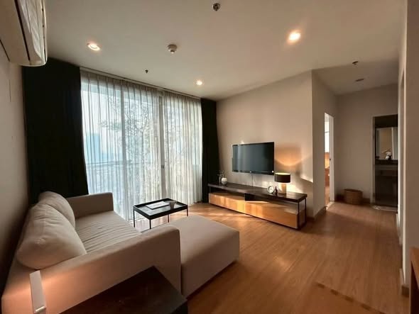 bedroom and living room of The Complete Narathiwas