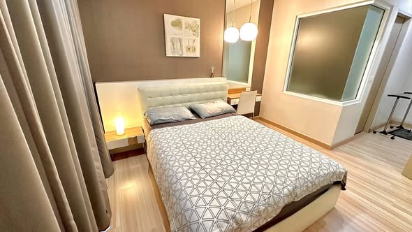 bedroom of The Hotel Serviced Condo เดอะโฮเทล คอนโด