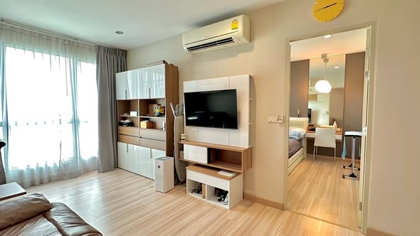 living room and bedroom of The Hotel Serviced Condo เดอะโฮเทล คอนโด