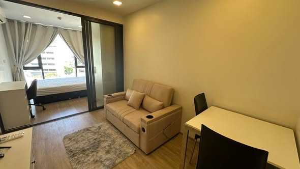 bedroom and living room of The Nest Chula-Samyan