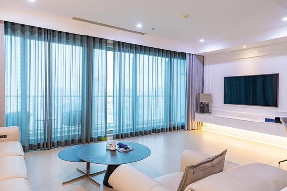 bedroom and living room of The River Condominium
