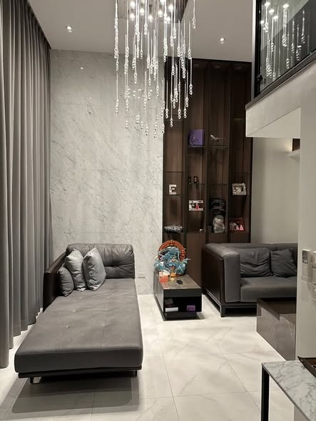 bedroom and living room of The Roof Townhome
