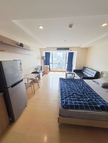 bedroom of The Trendy Condominium