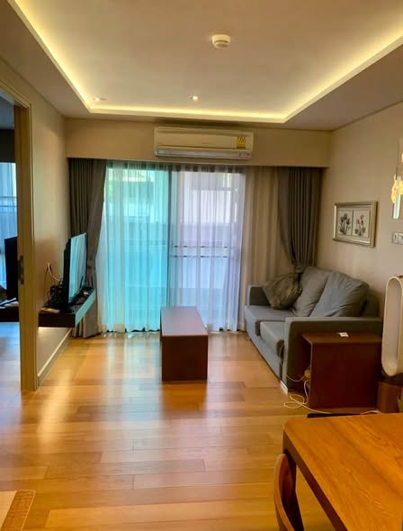 bedroom and living room of Tidy Deluxe Condominium