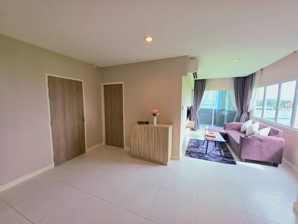 living room and bedroom of 103 Condominium