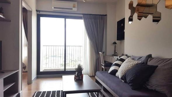 living room and bedroom of Chapter One Midtown Lat Phrao 24