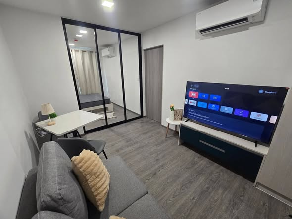 living room and bedroom of Kave Wonderland Sales Gallery