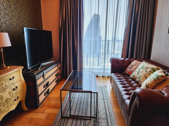 bedroom and living room of Keyne by Sansiri