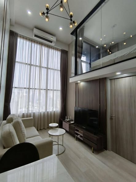 living room and bedroom of KnightsBridge Prime Sathon