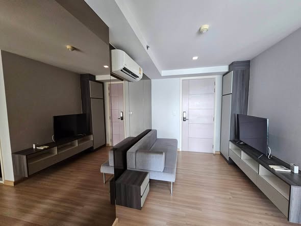 bedroom and living room of KnightsBridge Sky City