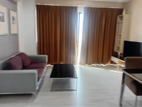 living room and bedroom of อัพเอกมัยคอนโดมิเนียม