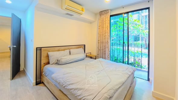 bedroom of Metro Luxe Riverfront Rattanathibet
