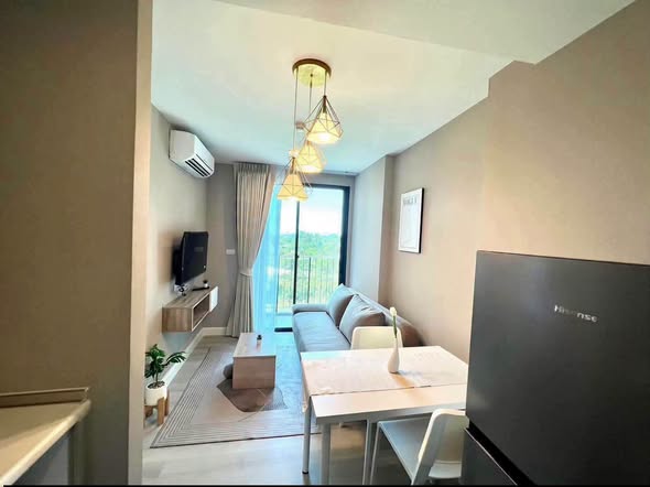 living room and bedroom of Metro Luxe Riverfront Rattanathibet