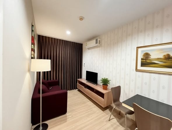 living room and bedroom of NicesuitesII Sanambinnam