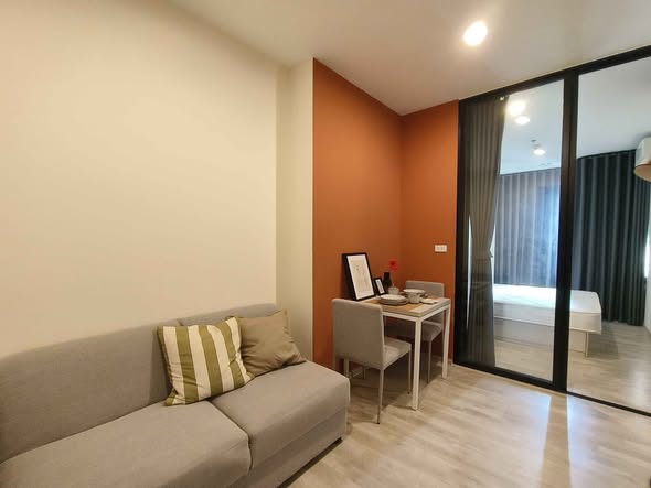 bedroom and living room of นิช โมโน เมกะ สเปซ บางนา (Niche MONO Mega Space Bang Na)