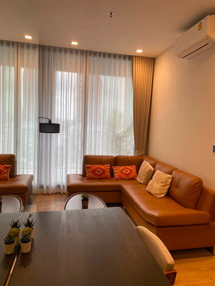 bedroom and living room of Noble Around Ari