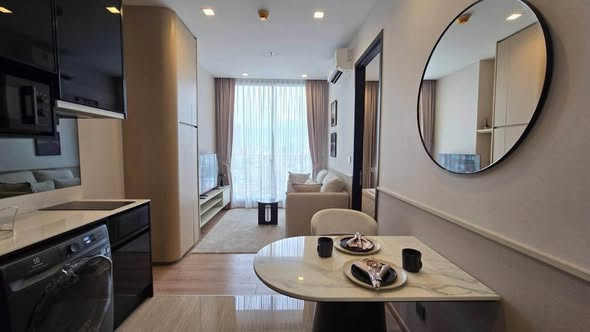 bedroom and living room of Noble Around Ari