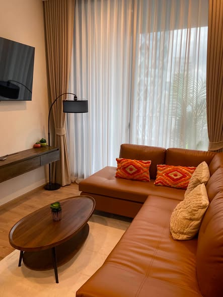 living room and bedroom of Noble Around Ari