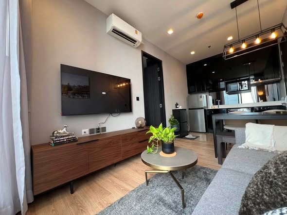 living room and bedroom of Noble Around Ari