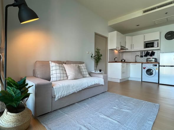living room and bedroom of Noble Reveal