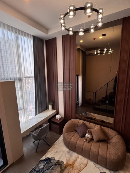 living room and bedroom of Park Origin Chula-Sam Yan