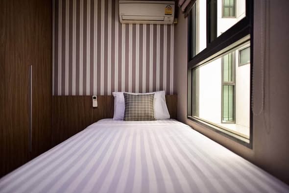 bedroom of Qube Suites Sukhumvit 46