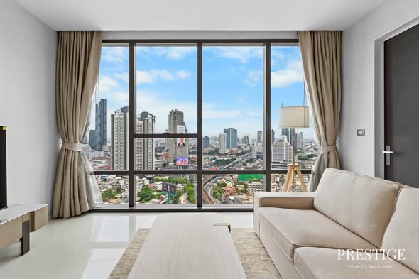 bedroom and living room of The Bangkok Sathorn