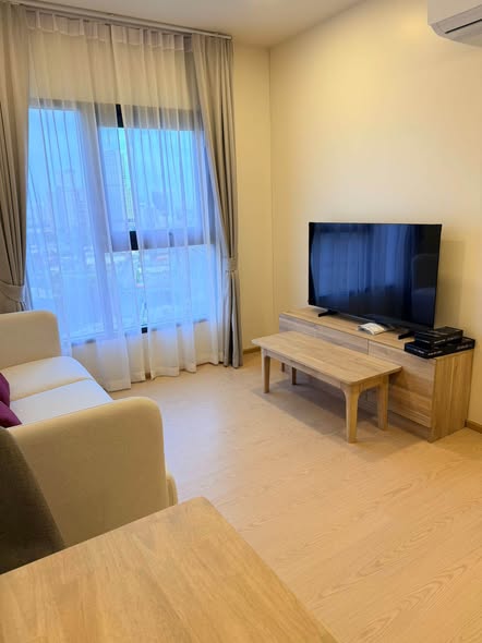 bedroom and living room of The Base Urban Rama9