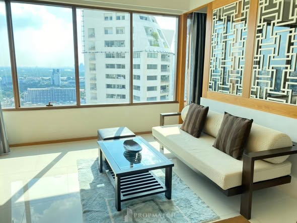 living room and bedroom of The Emporio Place