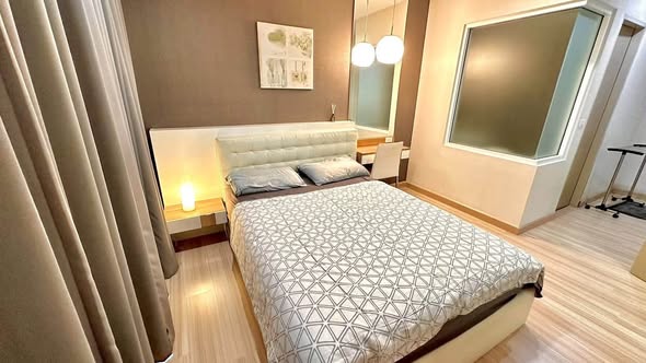 bedroom of The Hotel Serviced Condo เดอะโฮเทล คอนโด