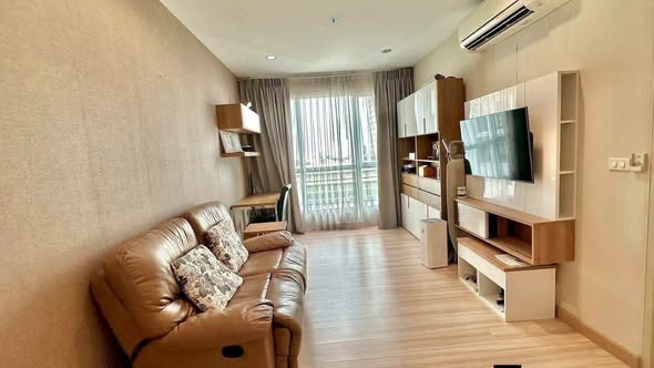 living room and bedroom of The Hotel Serviced Condo เดอะโฮเทล คอนโด