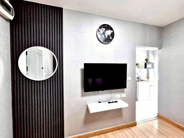 living room and bathroom of The Kith Plus Sukhumvit 113