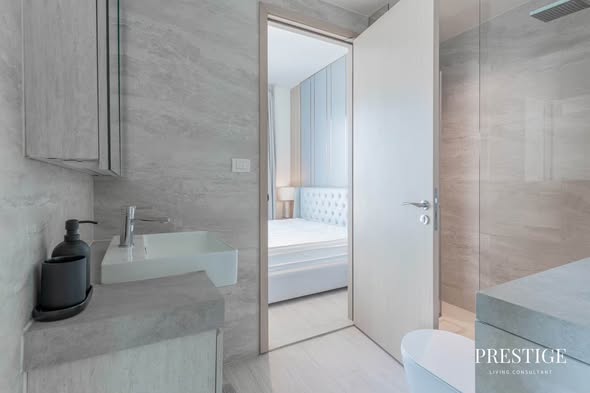 bedroom and bathroom of The Lofts Silom by Raimon Land
