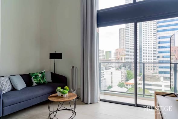 living room of The Lofts Silom by Raimon Land