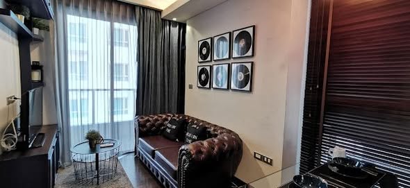 living room and bedroom of The Lumpini 24