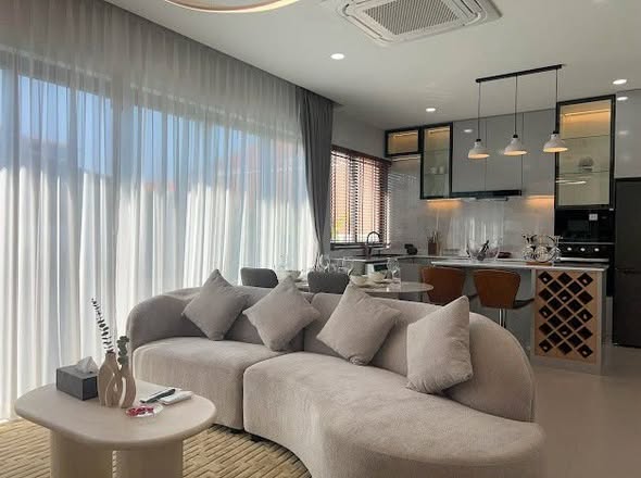 living room and bedroom of บ้านพักหัวหิน The Modern Pool Villa