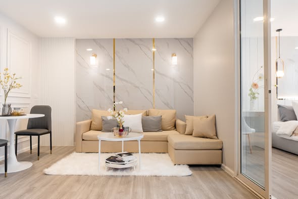 living room and bedroom of The Raffles Condominium