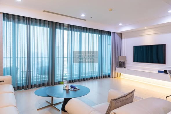 bedroom and living room of The River Condominium