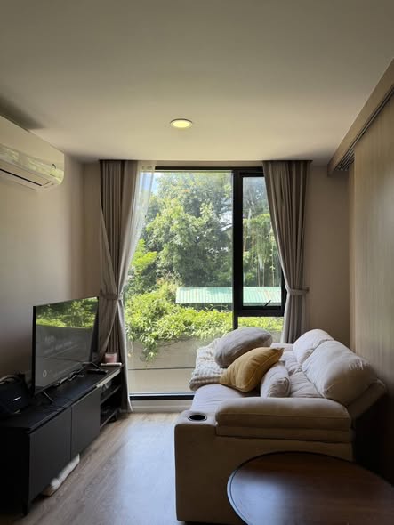 bedroom and living room of The TEAK Sathon-Lumphini