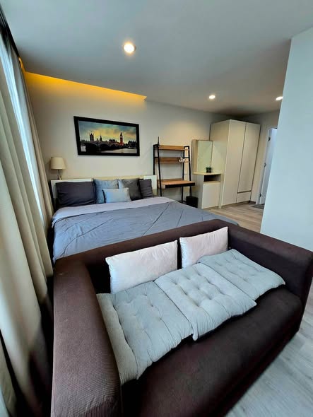 bedroom and living room of TRAMS Condominium