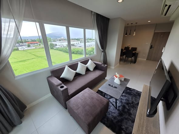 living room and bedroom of 103 Central condominium