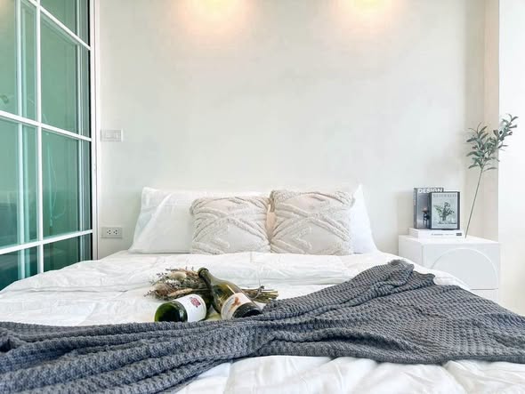 bedroom and room interior of 103 Condominium 5